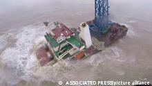 In this image released by Hong Kong Government Flying Service, a helicopter with rescue crew members approaches a sinking ship in the South China Sea, 300 kilometers (186 miles) south of Hong Kong, Saturday, July 2, 2022, as Typhoon Chaba was moving in the area. The industrial support ship operating in the South China Sea has sunk with the possible loss of more than two dozen crew members, rescue services in Hong Kong said Saturday. (Hong Kong Government Flying Service via AP)