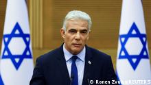 Israeli Foreign Minister Yair Lapid speaks next to Prime Minister Naftali Bennett (not pictured) as they give a statement at the Knesset, Israel's parliament, in Jerusalem, June 20, 2022. REUTERS/Ronen Zvulun