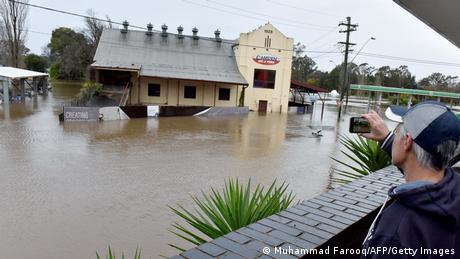 Thousands of Australians were ordered to evacuate their homes in Sydney on July 3 as torrential rain battered the country's largest city and floodwaters inundated its outskirts.