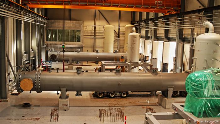 A light room furnished with two large pipes and other equipment A light room furnished with two large pipes and other equipment
