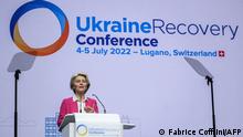 President of the European Commission Ursula Von der Leyen delivers a speech at the start of a two-day International conference on reconstruction of Ukraine, in Lugano on July 4, 2022. - Ministers from dozens of countries and organisations leadrers gathered in Switzerland Monday to hash out a Marshall Plan to rebuild the war-torn country. (Photo by Fabrice COFFRINI / AFP)