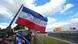 An upside-down Dutch flag is seen lining a farm in The Netherlands