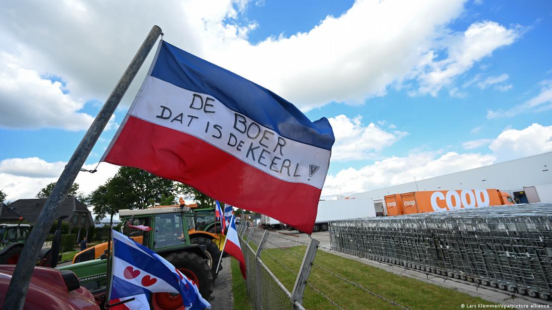 An upside-down Dutch flag is seen lining a farm in The Netherlands