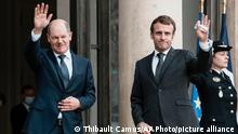 German Chancellor Olaf Scholz, left, is welcomed by French President Emmanuel Macron at the Elysee Palace in Paris, Friday, Dec. 10, 2021. Two days after taking office, Scholz visits the French President in Paris as well as top EU and Nato personnel in Brussels. (Thibault Camus/AP Photo