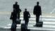 People walking with suitcases People walking with suitcases