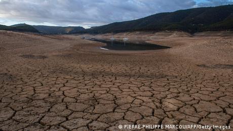 A picture shows low water levels at a reservoir in drought-stricken Entrepenas near Sacedon 