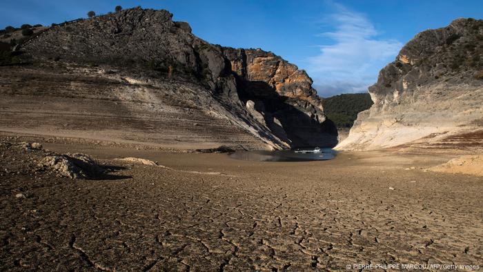 The dry bed of a reservoir