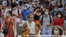 ARCHIV People with protective mask walk on a pedestrian street in Lyon on August 22, 2020 on the first day of mandatory mask wearing in parts of city centre. - Masks are obligatory to curb the spread of COVID-19 disease caused by the novel coronavirus in France in open areas of some cities as well as on public transport and in enclosed spaces such as shops, banks and government offices. (Photo by PHILIPPE DESMAZES / AFP) (Photo by PHILIPPE DESMAZES/AFP via Getty Images)