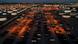 Cargo shipping containers are seen in a storage yard surrounded by petroleum storage tanks and oil refineries in Carson, California, on March 11, 2022 Cargo shipping containers are seen in a storage yard surrounded by petroleum storage tanks and oil refineries in Carson, California, on March 11, 2022