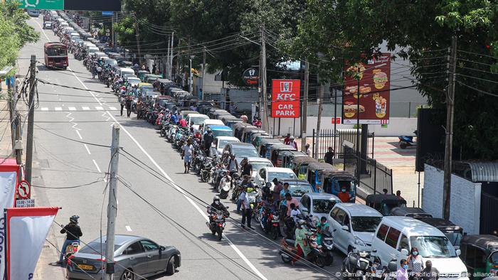 Long lines form outside a filling station in Colombo. 