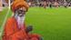 An Indian guru next to a football pitch An Indian guru next to a football pitch