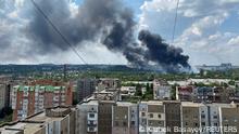 Smoke rises from the territory of an automotive centre following recent shelling during Ukraine-Russia conflict in Donetsk, Ukraine July 5, 2022. REUTERS/Kazbek Basayev