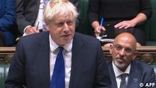 A video grab from footage broadcast by the UK Parliament's Parliamentary Recording Unit (PRU) shows Britain's Prime Minister Boris Johnson speaking next to Britain's newly appointed Chancellor of the Exchequer Nadhim Zahawi (R) during the weekly session of Prime Minister's Questions (PMQs) at the House of Commons in London on July 6, 2022. - Johnson's position as UK prime minister was on the brink, after two of his senior ministers quit in protest at his scandal-hit leadership, piling on pressure as he faced a grilling from angry MPs. (Photo by Handout / various sources / AFP) / RESTRICTED TO EDITORIAL USE - MANDATORY CREDIT AFP PHOTO / PRU - NO MARKETING - NO ADVERTISING CAMPAIGNS - DISTRIBUTED AS A SERVICE TO CLIENTS