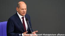 German Chancellor Olaf Scholz answers to questions of lawmaker during a session of the parliament Bundestag in Berlin, Germany, Wednesday, July 6, 2022. (AP Photo/Markus Schreiber)