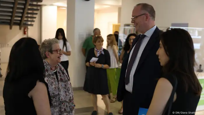 DW Akademie's Managing Director Carsten von Nahmen and EU Ambassador Andrea Wiktorin chat at the opening of the E-School in Yerevan on July 1, 2022