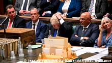 In this photo provided by UK Parliament, Britain's Prime Minister Boris Johnson, center, attends Prime Minister's Questions in the House of Commons in London, Wednesday, July 6, 2022. (Jessica Taylor/UK Parliament via AP)
