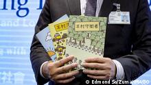 July 22, 2021, Hong Kong, China: Li Kwai-wah, senior superintendent of Police National Security Department, poses with evidence including three children s books on stories that revolve around a village of sheep which has to deal with wolves from a different village, before a press conference at Police Headquarters in Wan Chai. Hong Kong s national security police on Thursday arrested five members of the General Union of Hong Kong Speech Therapists on suspicion of conspiring to publish and distribute seditious material, in the latest arrests made amid a crackdown on dissent in the city. 22JUL21 SCMP / Hong Kong China - ZUMAs251 20210722_zin_s251_006 Copyright: xEdmondxSox