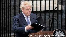 Prime Minister Boris Johnson arrives to read a statement outside 10 Downing Street, London, formally resigning as Conservative Party leader, in London, Thursday, July 7, 2022. Johnson said Thursday he will remain as British prime minister while a leadership contest is held to choose his successor. (AP Photo/Frank Augstein)