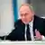 Russian President Vladimir Putin gestures as he speaks to members of the State Duma