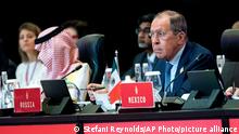 Russian's Foreign Minister Sergei Lavrov, right, attends a meeting at the G20 Foreign Ministers' Meeting in Nusa Dua on the Indonesian resort island of Bali Friday, July 8, 2022. (Stefani Reynolds/Pool Photo via AP) 