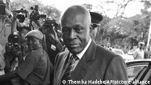 FILE - In this April 12, 2008 file photo Angola's President Jose Eduardo dos Santos arrives at the Mulungushi International Conference Center in Lusaka, Zambia. Dos Santos has ruled since 1979 and endured the issue of term limits never would haunt him by having legislators approve a new constitution in 2010 under which the leader of the party that wins most parliamentary seats would become president. (AP Photo/Themba Hadebe, File)