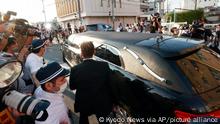 A hearse which is believed to carry the body of Japan's former Prime Minister Shinzo Abe leaves a hospital in Kashihara, Nara prefecture, western Japan Saturday, July 9, 2022. Former Prime Minister Shinzo Abe was assassinated on a street in western Japan by a gunman who opened fire on him from behind as he delivered a campaign speech. (Kyodo News via AP)