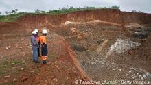 GOROMONZI, ZIMBABWE - JANUARY 11: Workers inspect an open cast at Arcadia Lithium mine on January 11, 2022 in Goromonzi, Zimbabwe. Last month, the Chinese firm Zhejiang Huayou Cobalt said it would pay over $400 million for the hard-rock lithium mine, whose product is a key ingredient in rechargeable batteries used in electric vehicles. The world's transition to clean energy may strain global mining capacity to produces these minerals. (Photo by Tafadzwa Ufumeli/Getty Images)