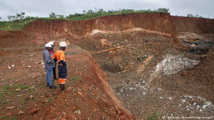 Workers inspect an open cast at Arcadia Lithium mine on January 11, 2022 in Goromonzi, Zimbabwe. 