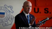 U.S. Homeland Security Secretary Alejandro Mayorkas applauds as he presents awards for outstanding contributions to Department of Homeland Security employees, Wednesday, April 13, 2022, at Coast Guard Air Station Miami, in Opa-locka, Fla. (AP Photo/Rebecca Blackwell)