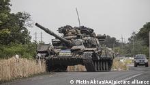 BAKHMUT, UKRAINE - JULY 10: A Ukrainian tank patrols the area as conflicts between Russian and Ukrainian forces continue in Bakhmut, Donetsk Oblast, Ukraine on July 10, 2022. Metin Aktas / Anadolu Agency