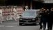 black hearst drives on street as military stand by black hearst drives on street as military stand by