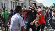 (FILES) In this file photo taken on July 11, 2021 a man is arrested during a demonstration against the government of Cuban President Miguel Diaz-Canel in Havana. - A total of 381 people who took part in unprecedented anti-government protests last July have been sentenced in Cuba for various crimes, the public prosecutor said on June 13, 2022. Of those, 36 people were sentenced to up to 25 years in prison for sedition. (Photo by YAMIL LAGE / AFP)