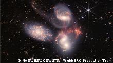 An enormous mosaic of Stephan’s Quintet is the largest image to date from the NASA/ESA/CSA James Webb Space Telescope, covering about one-fifth of the Moon’s diameter. It contains over 150 million pixels and is constructed from almost 1,000 separate image files. The visual grouping of five galaxies was captured by Webb’s Near-Infrared Camera (NIRCam) and Mid-Infrared Instrument (MIRI).
With its powerful, infrared vision and extremely high spatial resolution, Webb shows never-before-seen details in this galaxy group. Sparkling clusters of millions of young stars and starburst regions of fresh star birth grace the image. Sweeping tails of gas, dust and stars are being pulled from several of the galaxies due to gravitational interactions. Most dramatically, Webb’s MIRI instrument captures huge shock waves as one of the galaxies, NGC 7318B, smashes through the cluster. These regions surrounding the central pair of galaxies are shown in the colours red and gold.
This composite NIRCam-MIRI image uses two of the three MIRI filters to best show and differentiate the hot dust and structure within the galaxy. MIRI sees a distinct difference in colour between the dust in the galaxies versus the shock waves between the interacting galaxies. The image processing specialists at the Space Telescope Science Institute in Baltimore opted to highlight that difference by giving MIRI data the distinct yellow and orange colours, in contrast to the blue and white colours assigned to stars at NIRCam’s wavelengths.
Together, the five galaxies of Stephan’s Quintet are also known as the Hickson Compact Group 92 (HCG 92). Although called a “quintet,” only four of the galaxies are truly close together and caught up in a cosmic dance. The fifth and leftmost galaxy, called NGC 7320, is well in the foreground compared with the other four. NGC 7320 resides 40 million light-years from Earth, while the other four galaxies (NGC 7317, NGC 7318A, NGC 7318B, and NGC 7319) are about 290 million light-years away. This is still fairly close in cosmic terms, compared with more distant galaxies billions of light-years away. Studying these relatively nearby galaxies helps scientists better understand structures seen in a much more distant universe.
This proximity provides astronomers a ringside seat for witnessing the merging of and interactions between galaxies that are so crucial to all of galaxy evolution. Rarely do scientists see in so much exquisite detail how interacting galaxies trigger star formation in each other, and how the gas in these galaxies is being disturbed. Stephan’s Quintet is a fantastic laboratory for studying these processes fundamental to all galaxies.
Tight groups like this may have been more common in the early Universe when their superheated, infalling material may have fueled very energetic black holes called quasars. Even today, the topmost galaxy in the group – NGC 7319 – harbors an active galactic nucleus, a supermassive black hole that is actively accreting material.
In NGC 7320, the leftmost and closest galaxy in the visual grouping, NIRCam was remarkably able to resolve individual stars and even the galaxy’s bright core. Old, dying stars that are producing dust clearly stand out as red points with NIRCam.
The new information from Webb provides invaluable insights into how galactic interactions may have driven galaxy evolution in the early Universe.
As a bonus, NIRCam and MIRI revealed a vast sea of many thousands of distant background galaxies reminiscent of Hubble’s Deep Fields.
NIRCam was built by a team at the University of Arizona and Lockheed Martin’s Advanced Technology Center.
