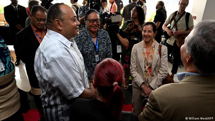 Tongan Prime Minister Siaosi Sovaleni speaking with Monica Medina, the US government's assistant secretary of state for oceans and international environmental and scientific affairs, after Harris' speech.