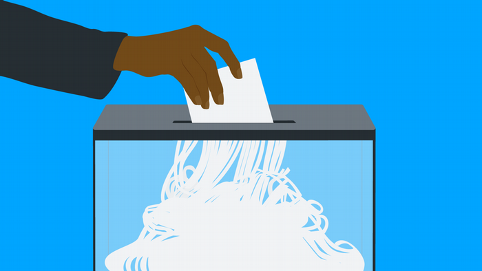 Illustration: A ballot is inserted into a ballot box and shredded in the process