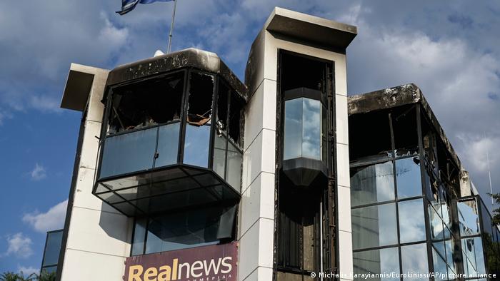 Burns marks and broken windows at the Real News office in Athens
