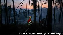Firefighters work to extinguish a wildfire at Casais do Vento in Alvaiazere on July 10, 2022. - Around 1.500 firefighters were mobilized to put out three wildfires raging for more than 48 hours in central and northern Portugal, as the country was hit by a heat wave that prompted the government to declare a state of contingency. (Photo by PATRICIA DE MELO MOREIRA / AFP) (Photo by PATRICIA DE MELO MOREIRA/AFP via Getty Images)