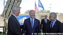 U.S. President Joe Biden, Israeli caretaker Prime Minister Yair Lapid and Israeli Defence Minister Benny Gantz stand in front of Israel's Iron Dome defence system, during a tour at Ben Gurion Airport, in Lod, near Tel Aviv, Israel, July 13, 2022. Gil Cohen-Magen/Pool via REUTERS