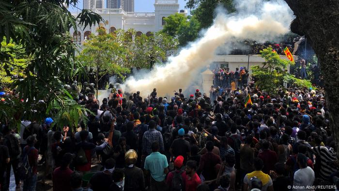 Demonstrators gather outside the office of Prime Minister Ranil Wickremesinghe.