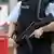 A heavily armed policeman patrols Hamburg Airport