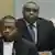 Jean-Pierre Bemba, right, with one of his lawyers at the International Criminal Court