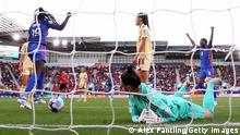 ROTHERHAM, ENGLAND - JULY 14: Griedge Mbock Bathy of France celebrates after scoring their team's second goal as Nicky Evrard of Belgium reacts during the UEFA Women's Euro 2022 group D match between France and Belgium at The New York Stadium on July 14, 2022 in Rotherham, England. (Photo by Alex Pantling/Getty Images)