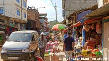 Title: Moreh
Who has taken that picture?: Prabhakar Mani Tewari
When was the picture taken ?: 26-02-2022
Where was the picture taken ?: MOREH (Manipur)
picture description: (What we can see in the picture, name etc.)— Moreh Town, Market, Businessmen and TAMIL SANGAM office