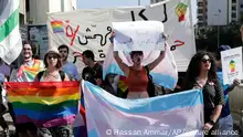 Activists from the Lesbian, Gay, Bisexual, and Transgender (LGBT) community in Lebanon shout slogans as they march calling on the government for more rights in the country gripped by economic and financial crisis during ongoing protests in Beirut, Lebanon, Saturday, June 27, 2020. (AP Photo/Hassan Ammar)