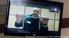 Russian opposition leader Alexei Navalny appears from prison on a video link provided by the Russian Federal Penitentiary Service, at a courtroom in Vladimir, Russia, Tuesday, June 7, 2022. A court in Vladimir region on Tuesday rejected an appeal of Russian opposition leader Alexei Navalny against the correctional colony's decision to label him a person inclined to commit crimes of a terrorist or extremist nature. (AP Photo/Vladimir Kondrashov)