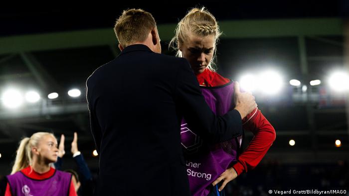 Ada Hegerberg is consoled after Norway's loss to England at Euro 2022