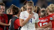 Norway's Ada Hegerberg, foreground, reacts as the Austria players celebrate in the background, at the end of the Women Euro 2022 group A soccer match between Austria and Norway at Brighton