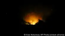 Flames are seen at the site of a plane crash, a few miles away from the city of Kavala, in northern Greece, Saturday, July 16, 2022. An Antonov cargo plane operated by a Ukraine-based air carrier crashed Saturday near the city of Kavala in northern Greece, authorities said. Greek Civil Aviation authorities say the flight was heading from Serbia to Jordan, but have not been able to confirm how many people were on board or what the plane's cargo was. (Ilias Kotsireas/InTime News via AP)