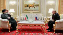 June 30, 2022, ASHGABAT, ASHGABAT, TURKMENISTAN: Russian President VLADIMIR PUTIN (R) speaks with Iran's President EBRAHIM RAISI (L) during their meeting on the sidelines of the 6th Caspian littoral states Summit in Ashgabat, Turkmenistan on June 29, 2022. President of Azerbaijan Ilham Aliyev, President of Iran Ebrahim Raisi, Russian President Vladimir Putin, and President of Kazakhstan Kassym-Jomart Tokayev are taking part in the summit at the invitation of Turkmen leader Serdar Berdimuhamedov. One of the main issues of the 6th Caspian Summit is the organization of a transport corridor through the Caspian Sea. The Trans-Caspian route is the most optimal and fastest, and capable of becoming very active in terms of Russian exports to India, Pakistan, Indonesia, Malaysia, and also the Persian Gulf states. In the opposite direction, it will work for Russia to receive various imported goods. (Credit Image: Â© Iranian Presidency via ZUMA Press Wire