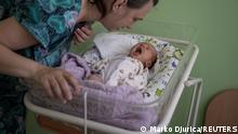 Elena, 36, checks on her baby Mikhail inside Pokrovsk maternity hospital, Donetsk region, eastern Ukraine, June 28, 2022. Doctors at the centre anecdotally observed that the smouldering conflict, which would kill more than 14,000 people between 2014 and 2022, was having an impact on pregnancies. REUTERS/Marko Djurica SEARCH DJURICA UKRAINE MATERNITY FOR THIS STORY. SEARCH WIDER IMAGE FOR ALL STORIES